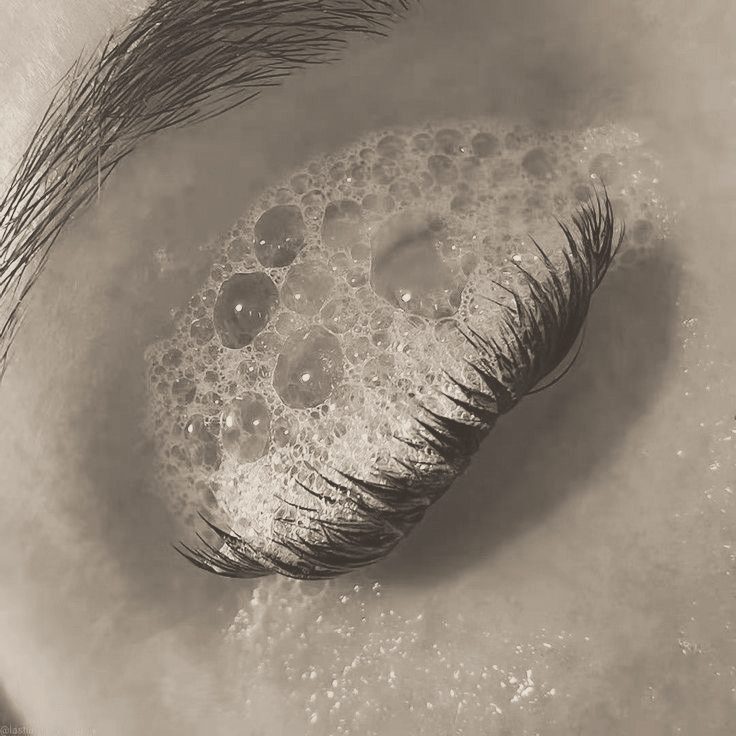 Lash extensions being cleansed